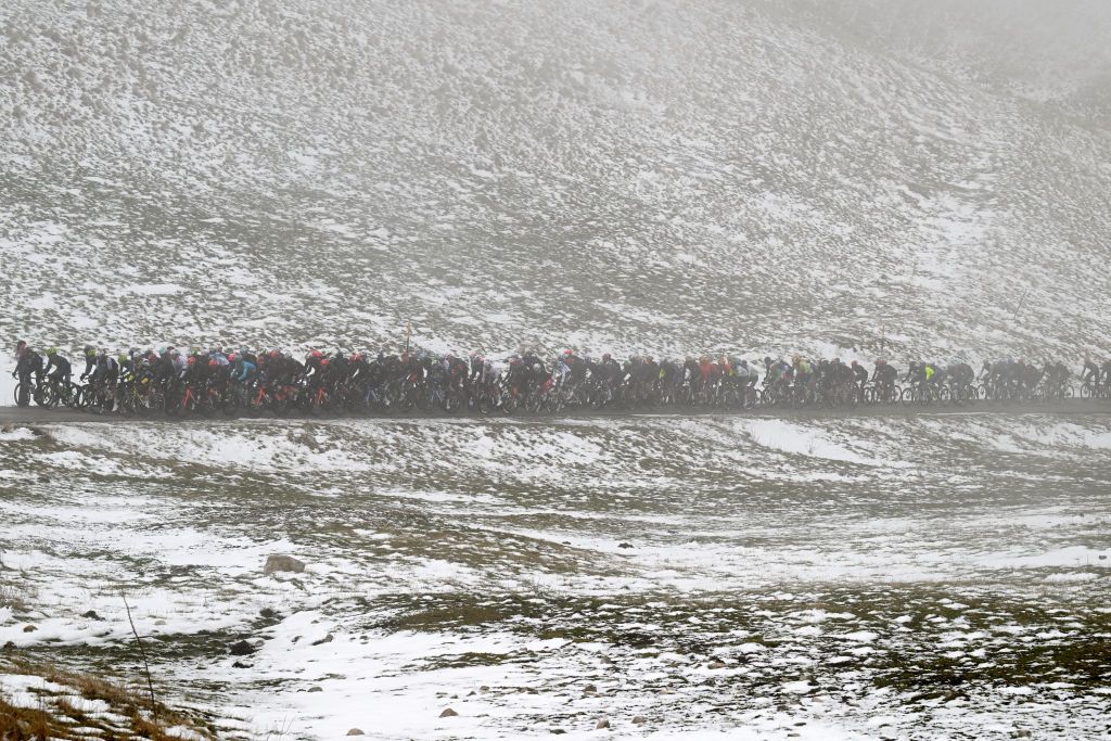 GIULIANOVA ITALY MARCH 07 A general view of the peloton climbing to the Forca di Presta 1538 m foggy and snowy landscape during the the 59th TirrenoAdriatico 2024 Stage 4 a 207km stage from Arrone to Giulianova UCIWT on March 07 2024 in Giulianova Italy Photo by Tim de WaeleGetty Images