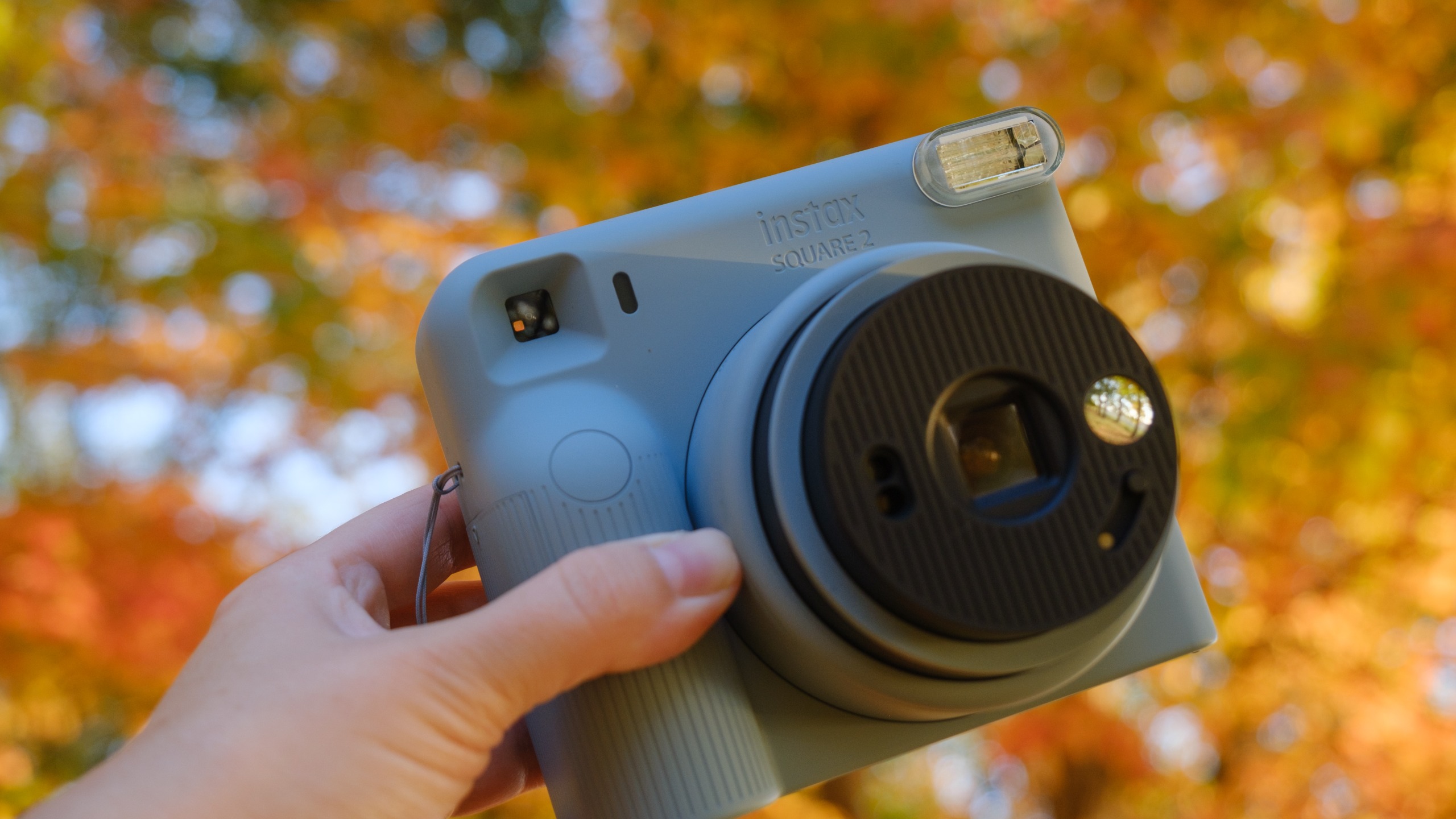 The Fujifilm Instax Square 2 camera photographed outside