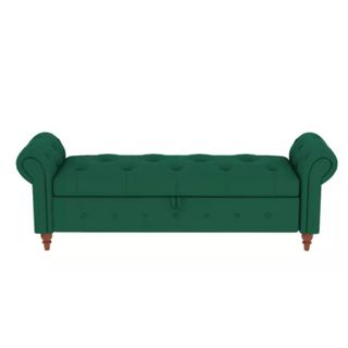 A long green button-tufted storage ottoman