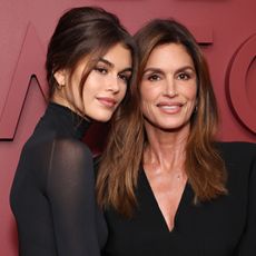 Kaia Gerber and Cindy Crawford pose for a photo wearing black
