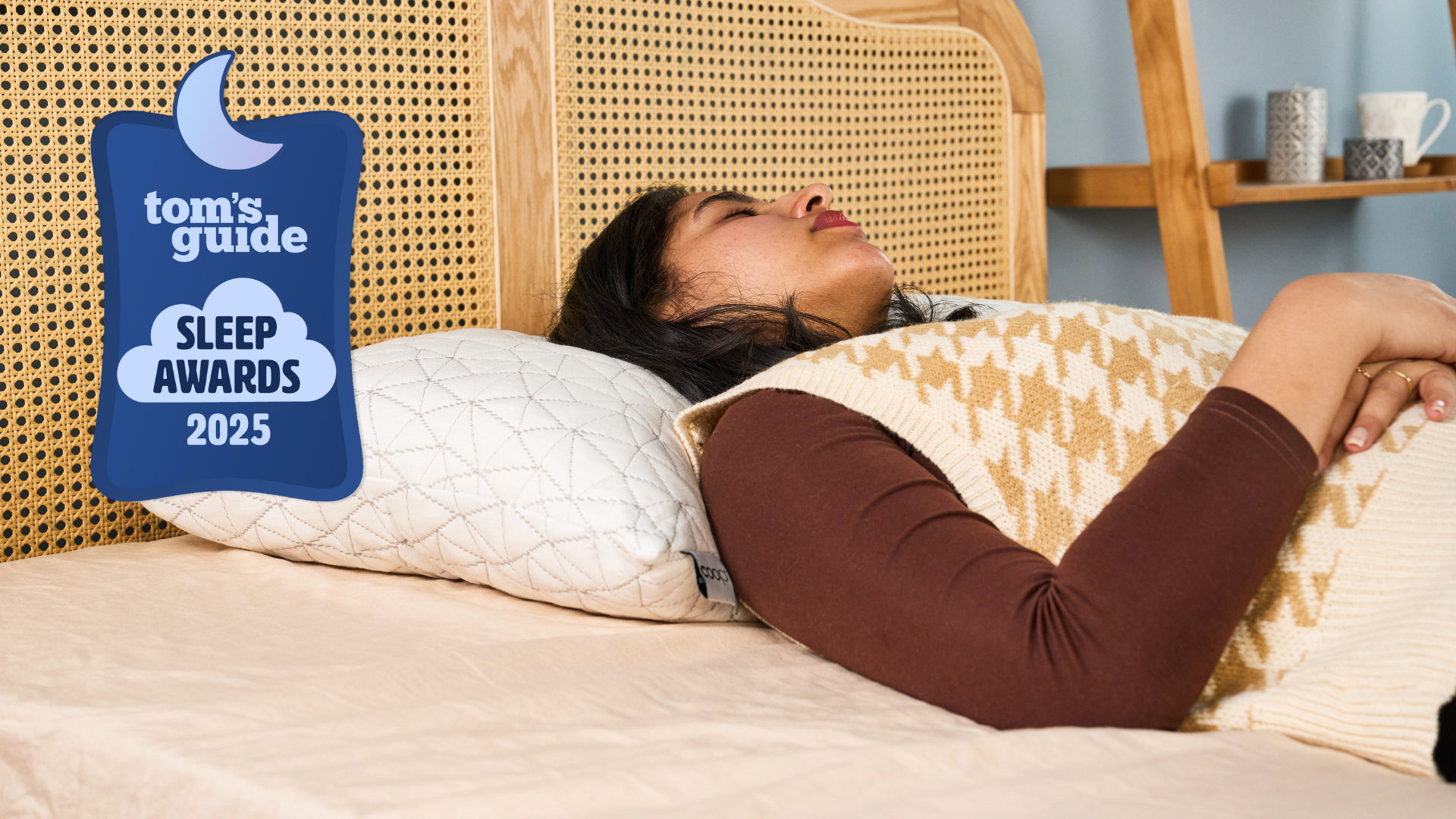 TG bedding writer sleeping on the Coop Original Adjustable in TG Sleep Studio and the TG Sleep Awards badge on the left 