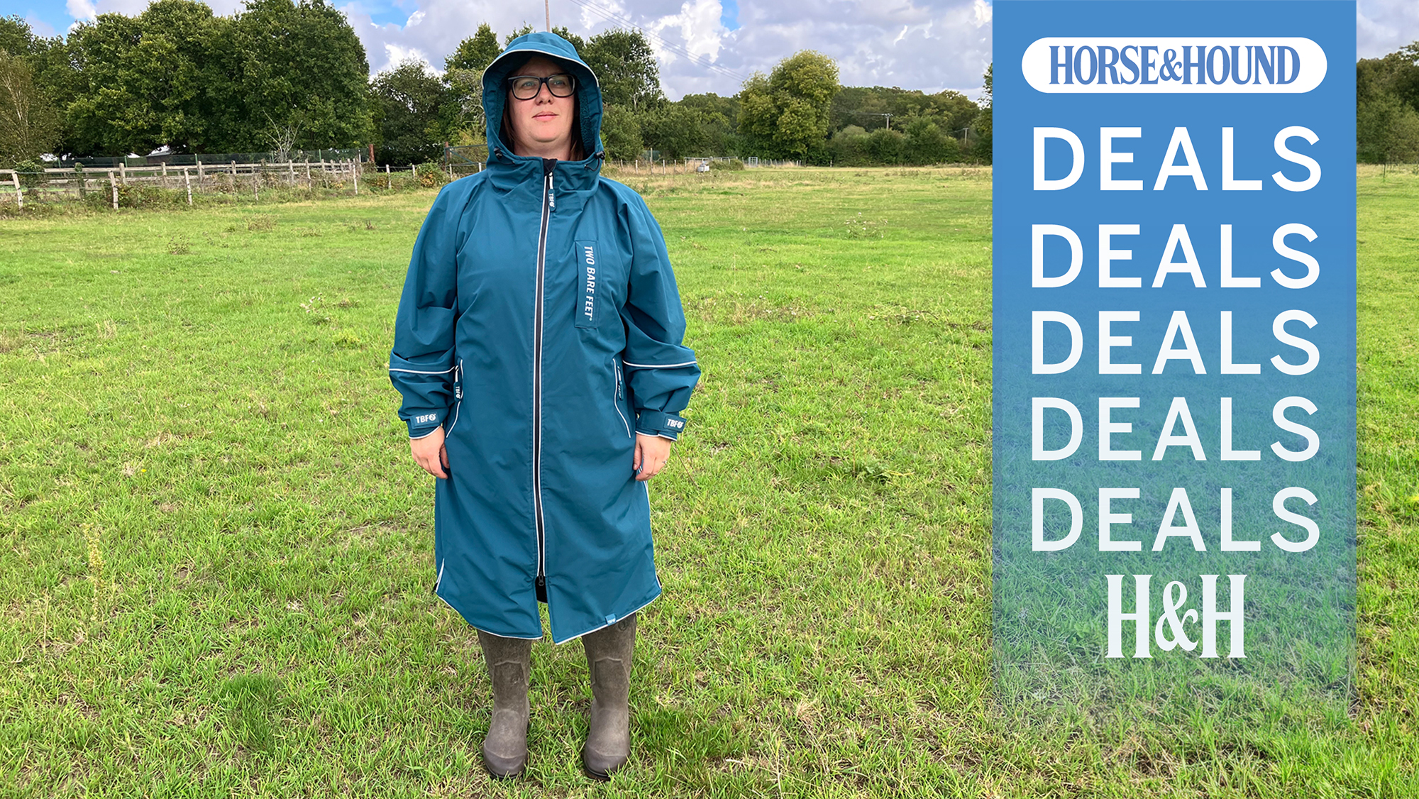 Fran wearing the Two Bear Feet riding coat in a field, with the H&amp;H deals graphic overlayed