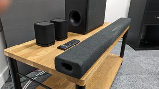Yamaha True X Soundbar System from side angle on wooden rack