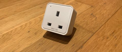 WiZ Smart Plug on a wooden floor