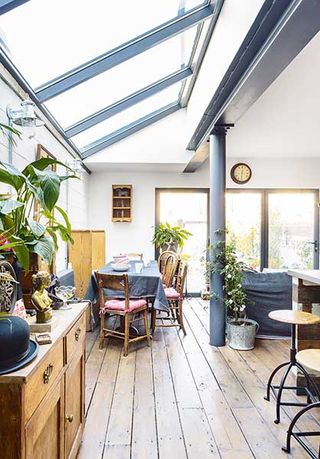 industrial style with reclaimed flooring and a glazed pitched roof in a Victorian Terraced house