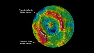 This topographic map from NASA's Dawn mission shows the two large impact basins in the southern hemisphere of the giant asteroid Vesta. Rheasilvia, the largest impact basin, is 310 miles (500 kilometers) wide. The other giant basin, Venenia, is 250 miles (400 km) across and is partly beneath Rheasilvia.