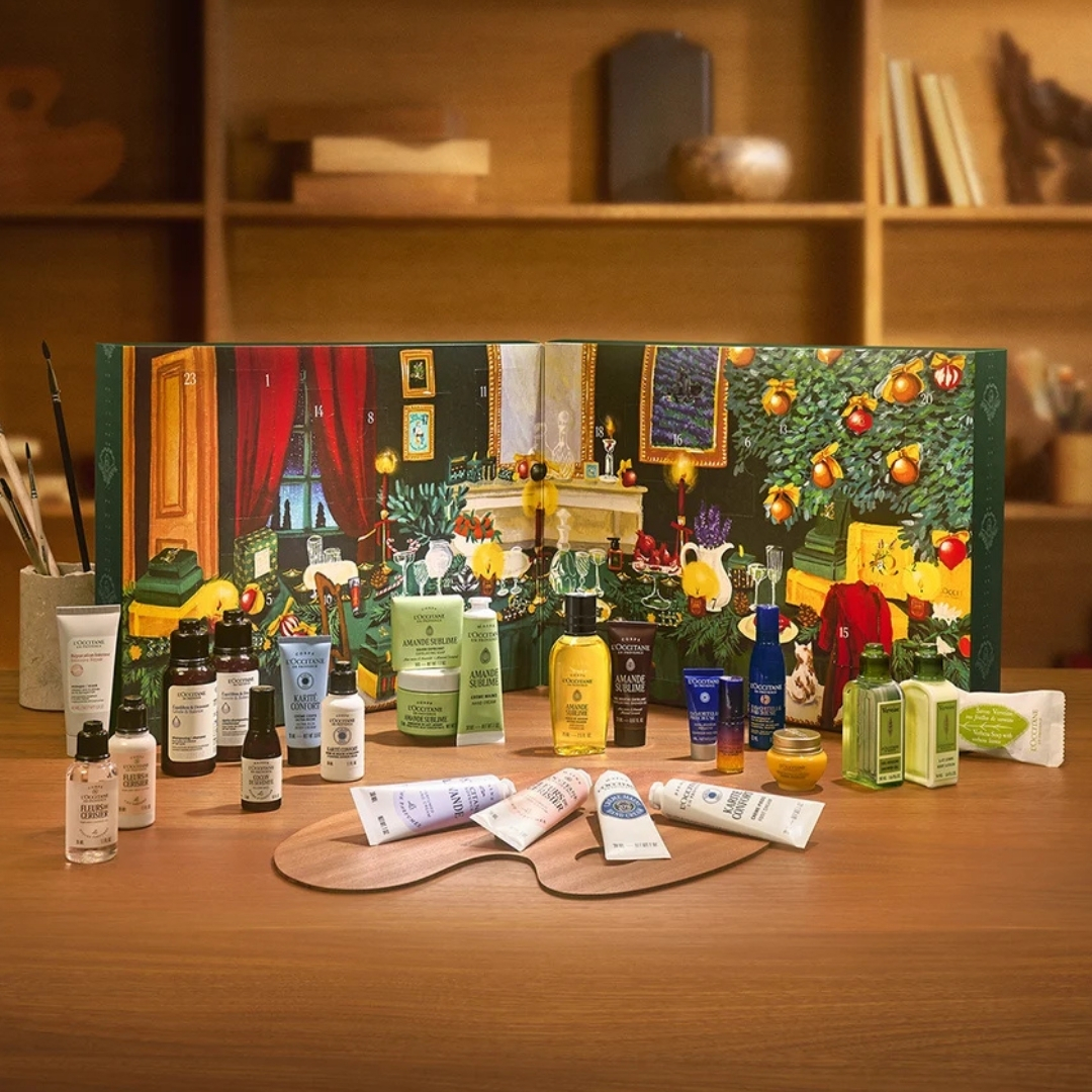 L'Occitane Classic Advent Calendar with its contents in front of it