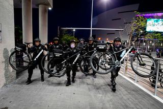 Police officers use their bicycles to control the crowd during a demonstration, in response to the recent death of George Floyd in police custody in Minneapolis, in Miami, Florida, on May 31, 2020