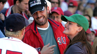 Actor Ben Affleck and wife, actress Jennifer Garner laugh with player Kevin Millar #15 of the Boston Red Sox prior to the start of the game against the New York Yankees at Fenway Park on October 1, 2005 in Boston, Massachusetts
