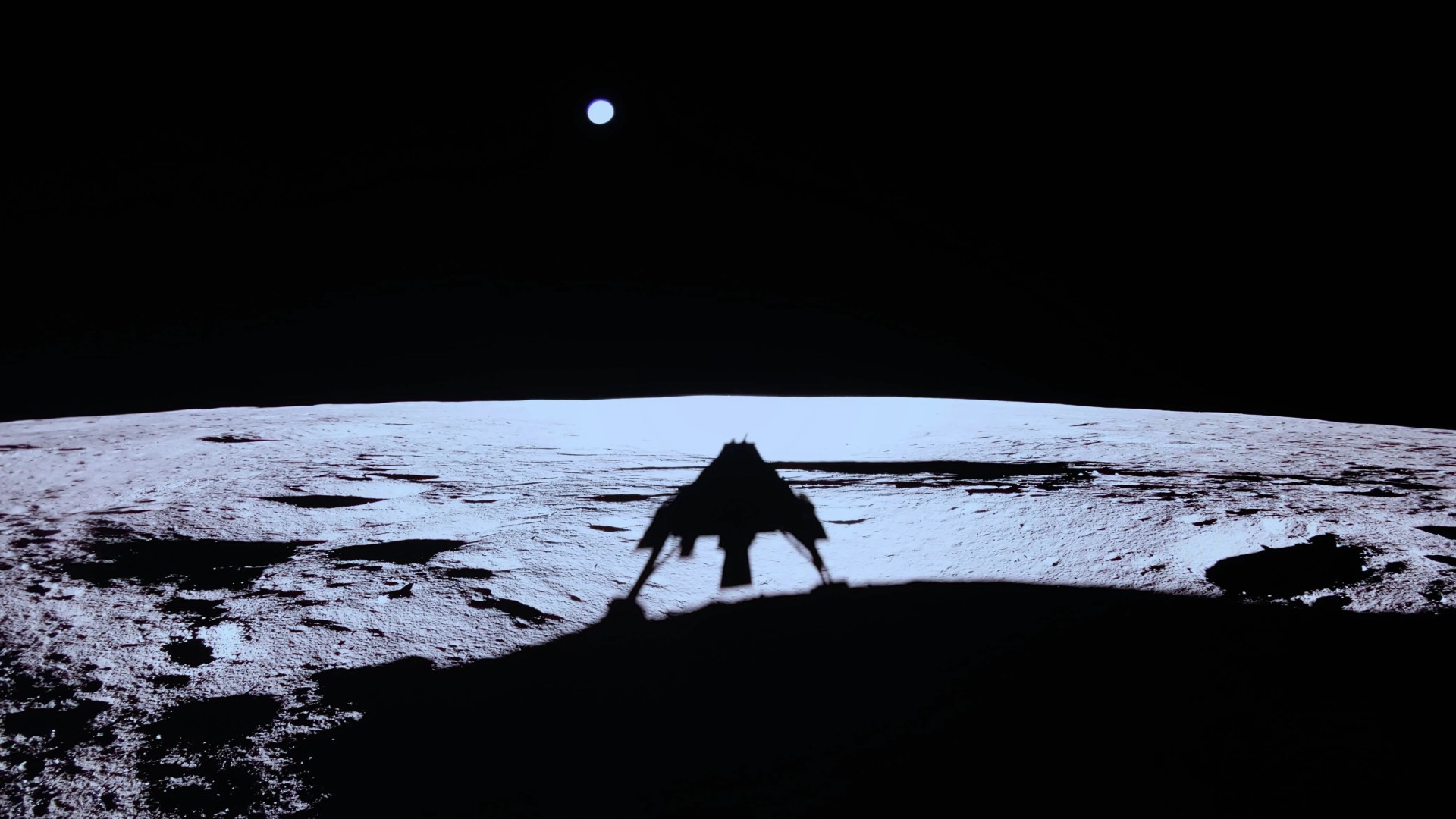 A photo from the surface of the moon showing the silhouette of a lunar lander with various legs on the surface with the Earth in the background