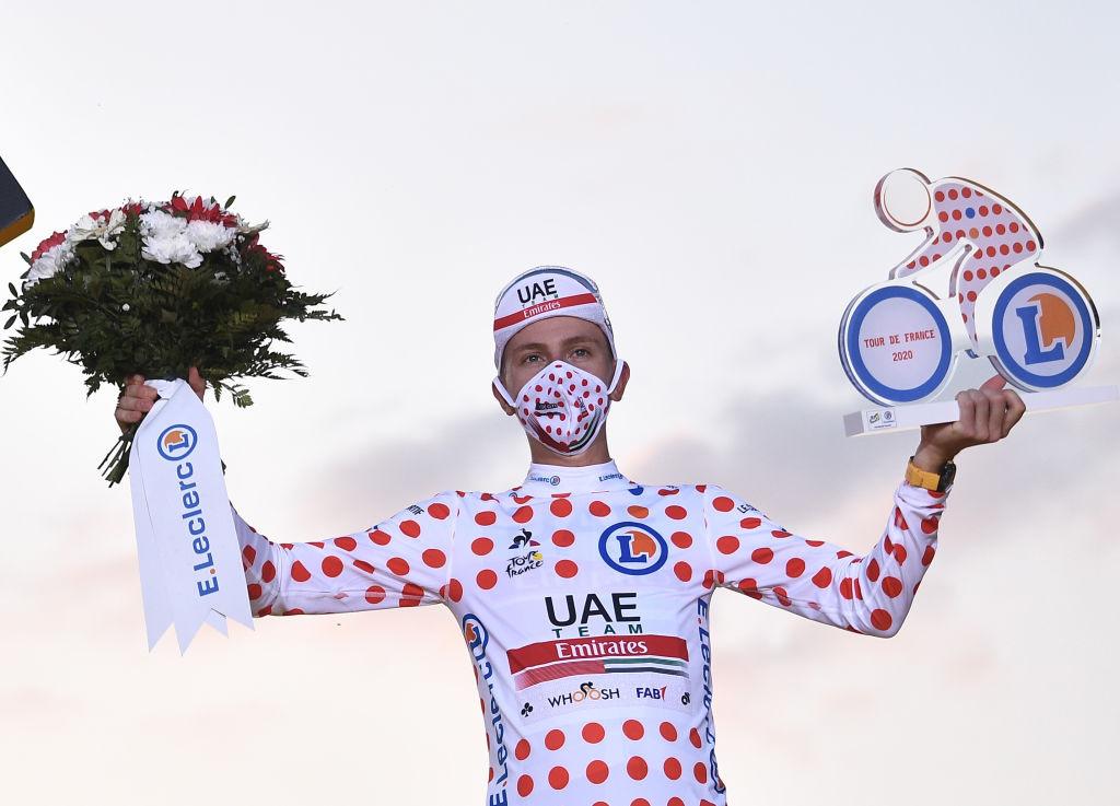 Team UAE Emirates rider Slovenias Tadej Pogacar celebrates on the podium after winning the best climbers polka dot jersey of the 107th edition of the Tour de France cycling race after the 21st and last stage of 122 km between ManteslaJolie and Champs Elysees Paris on September 20 2020 Photo by AnneChristine POUJOULAT AFP Photo by ANNECHRISTINE POUJOULATAFP via Getty Images