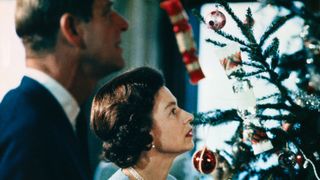 Christmas at Windsor Castle is shown here with Queen Elizabeth II and Prince Philip shown putting finishing touches to Christmas tree, in a photo made recently during the filming of the joint ITV-BBC film documentary, The Royal Family.