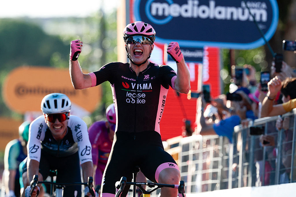 Team Visma-Lease a Bike's Dutch rider Olav Kooij celebrates after victory as he crosses the finish of the 21st and last stage of the 108th Giro d'Italia cycling race of 143kms from Rome to Rome on June 1, 2025. (Photo by Luca Bettini / AFP)