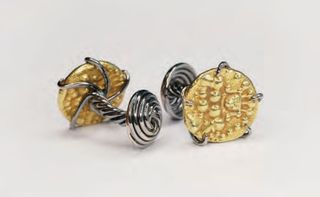 Gold coin cufflinks in spiralling frames