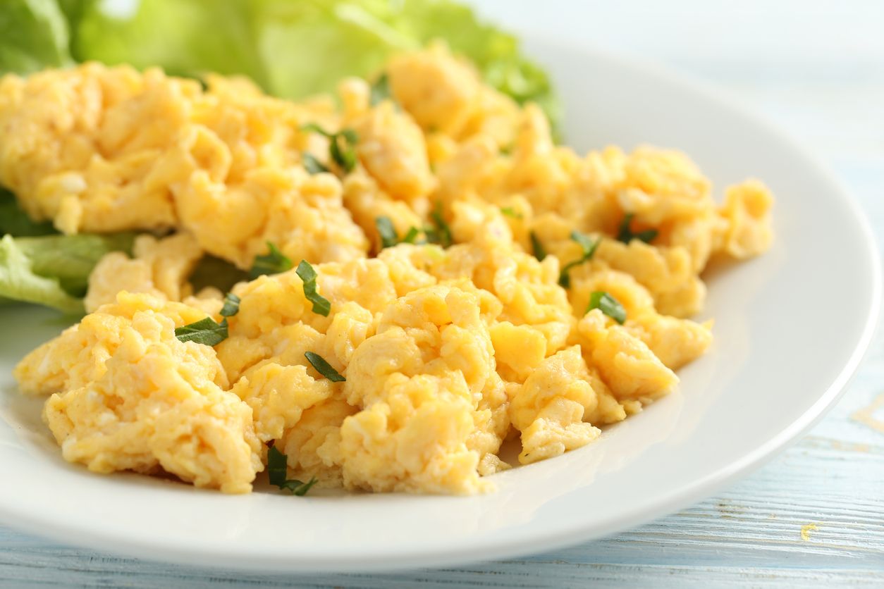 Scrambled eggs on a plate.