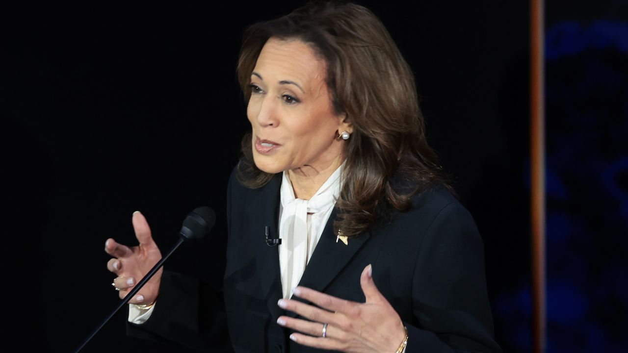 kamala harris at the debate wearing a black suit