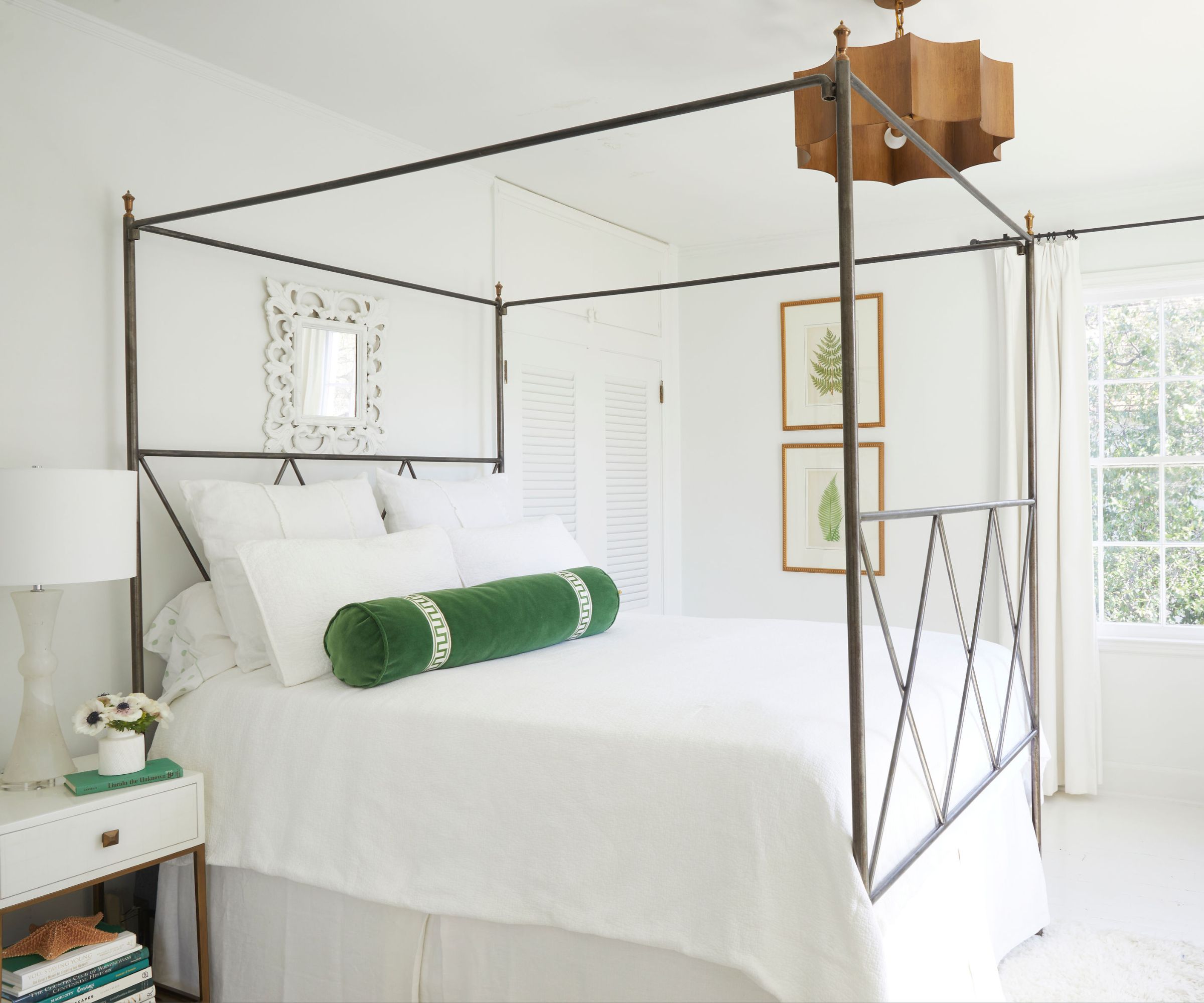 bedroom with white walls and four-poster bed