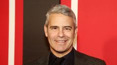 andy cohen on a red background