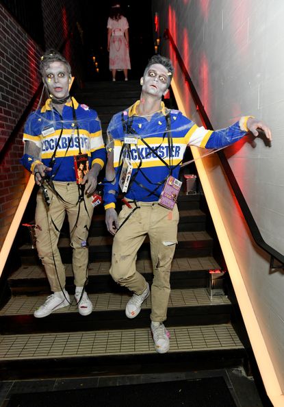  Antoni Porowski and Kevin Harrington as Zombie Blockbuster Employees