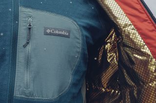 closeup photo of blue fabric with a columbia sportswear logo on it.
