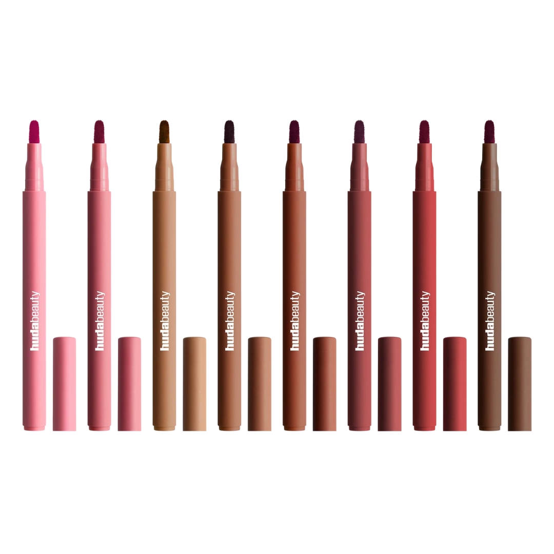Entire lineup of the Huda Beauty Lip Contour Lip Stains (L-R) Baby Pink, Rosewood, Soft Nude, Toasty Brown, Warm Brown, Cinnamon, Cherry Red and Rich Brown