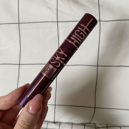 valeza holding the maybelline sky high burgundy mascara