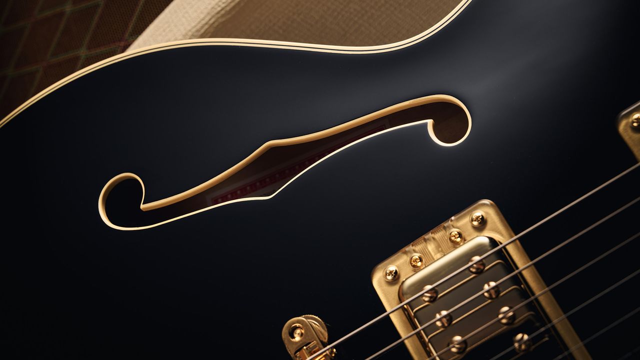 Gretsch Professional Collection Broadkaster LX Center Block: the handsome semi-hollow is finished in black with gold hardware and here is photographed in close-up.