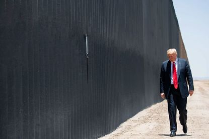 Donald Trump participates in a ceremony commemorating the 200th mile of border wall at the international border with Mexico in San Luis, Arizona,