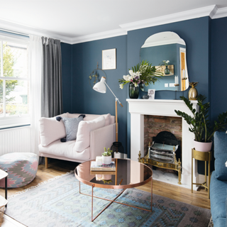A living room decorated in deep blues