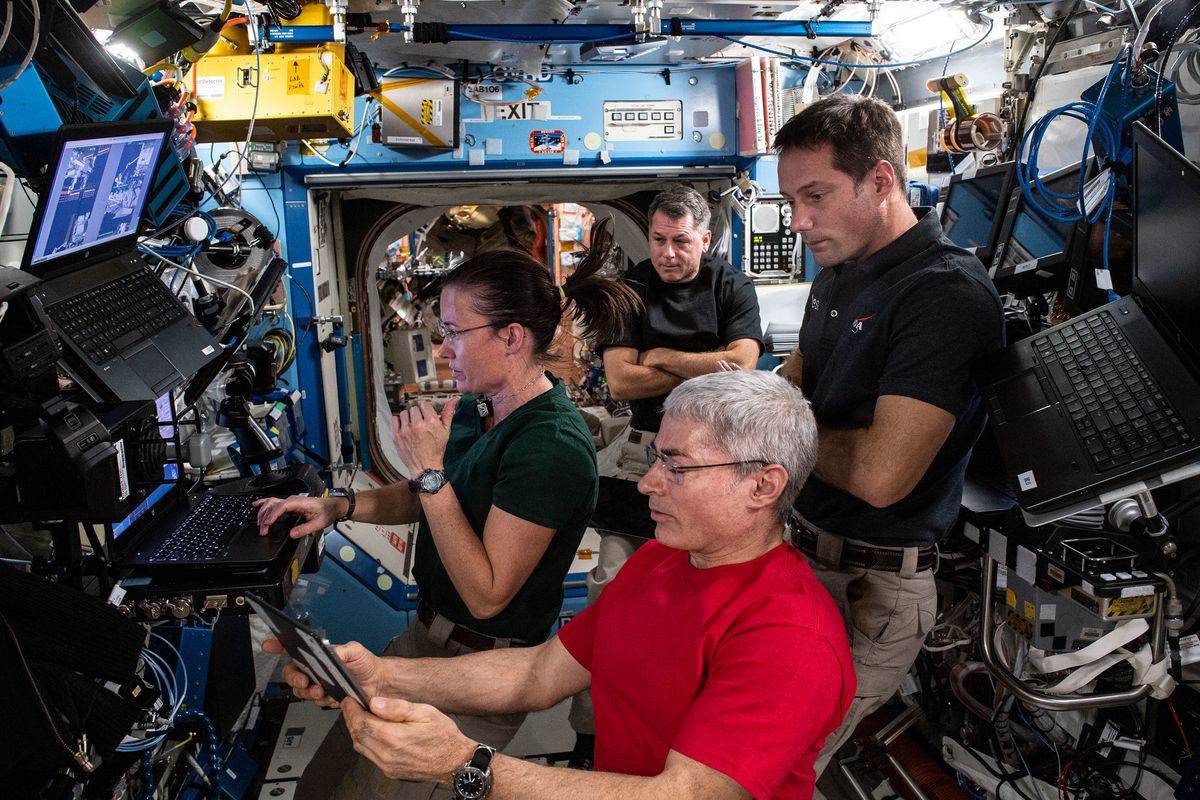 NASA astronauts Meghan McArthur (left), Shane Kimbrough (top center), Mark Vande Hei (bottom) and French astronaut Thomas Pesquet of the European Space Agency review spacewalk preparations on June 10, 2021. The three Americans won&#039;t have a long weekend for Fourth of July 2021.