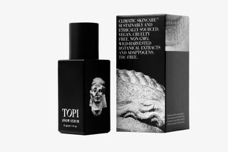 black bottle of Topi Snow Serum