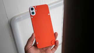 The CMF Phone 1 with the vegan leather orange back