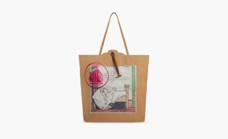 View of a brown Lanvin tote bag featuring the Little Nemo cartoon by Winsor McCay and a pink stamp-like design over the top. The bag is pictured against a light coloured background