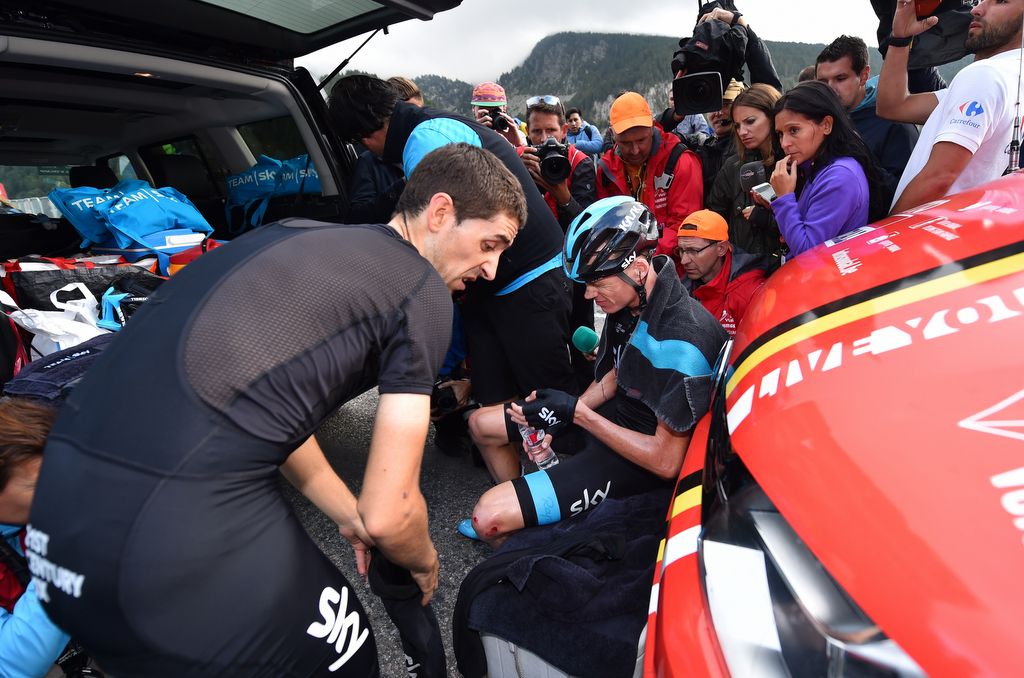 Chris Froome (Team Sky) is surrounded by media at the team car