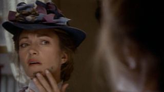 Jane Seymour examines some dirt on her face in Dr. Quinn Medicine Woman.