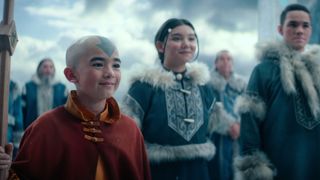 Aang smiles as Katara and Sokka stand in the background in Avatar: The Last Airbender