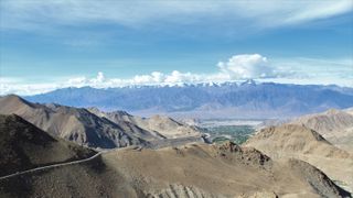 A photo of the Kashmir Valley taken from the top of one of the peaks on its rim