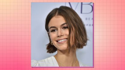 image of model kaia gerber with Italian bob haircut on a peach background