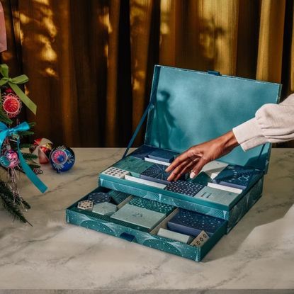 best advent calendars - woman's hand reaching down to the papier advent calendar