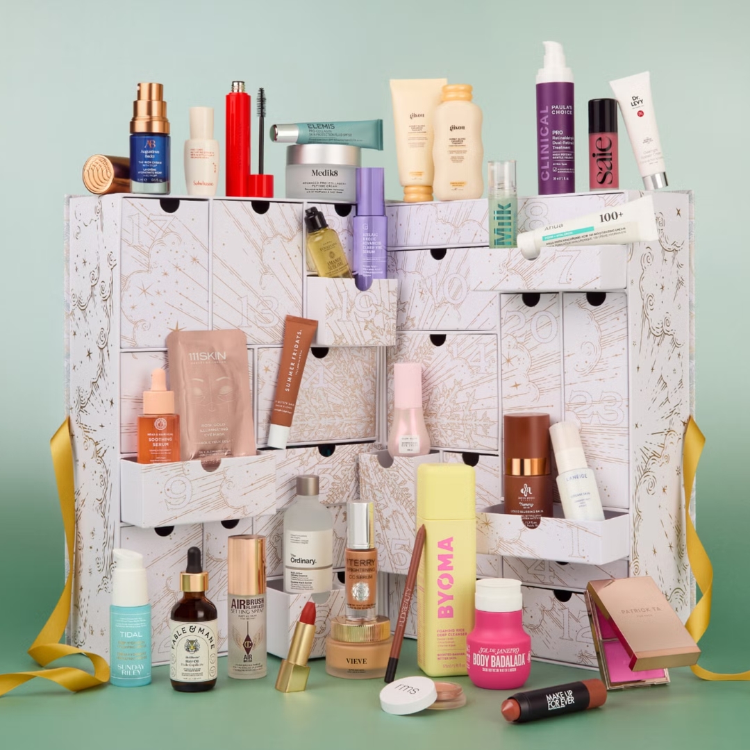 The Cult Beauty Advent Calendar Signature Edition with its contents in front of it