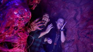 Two guests freak out during a scary moment at Halloween Horror Nights Universal Orlando. 
