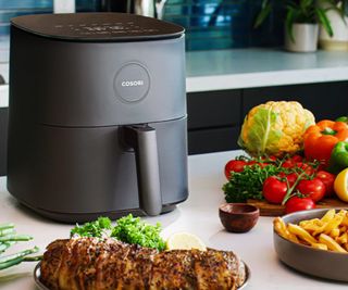 Cosori Pro LE Air Fryer on a kitchen counter.