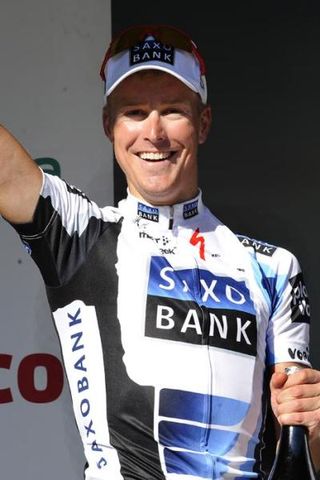 Lars Ytting Bak (Team Saxo Bank) celebrates his stage win on the podium.
