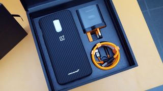 There was a book, carbon fiber case and Papaya Orange accessories