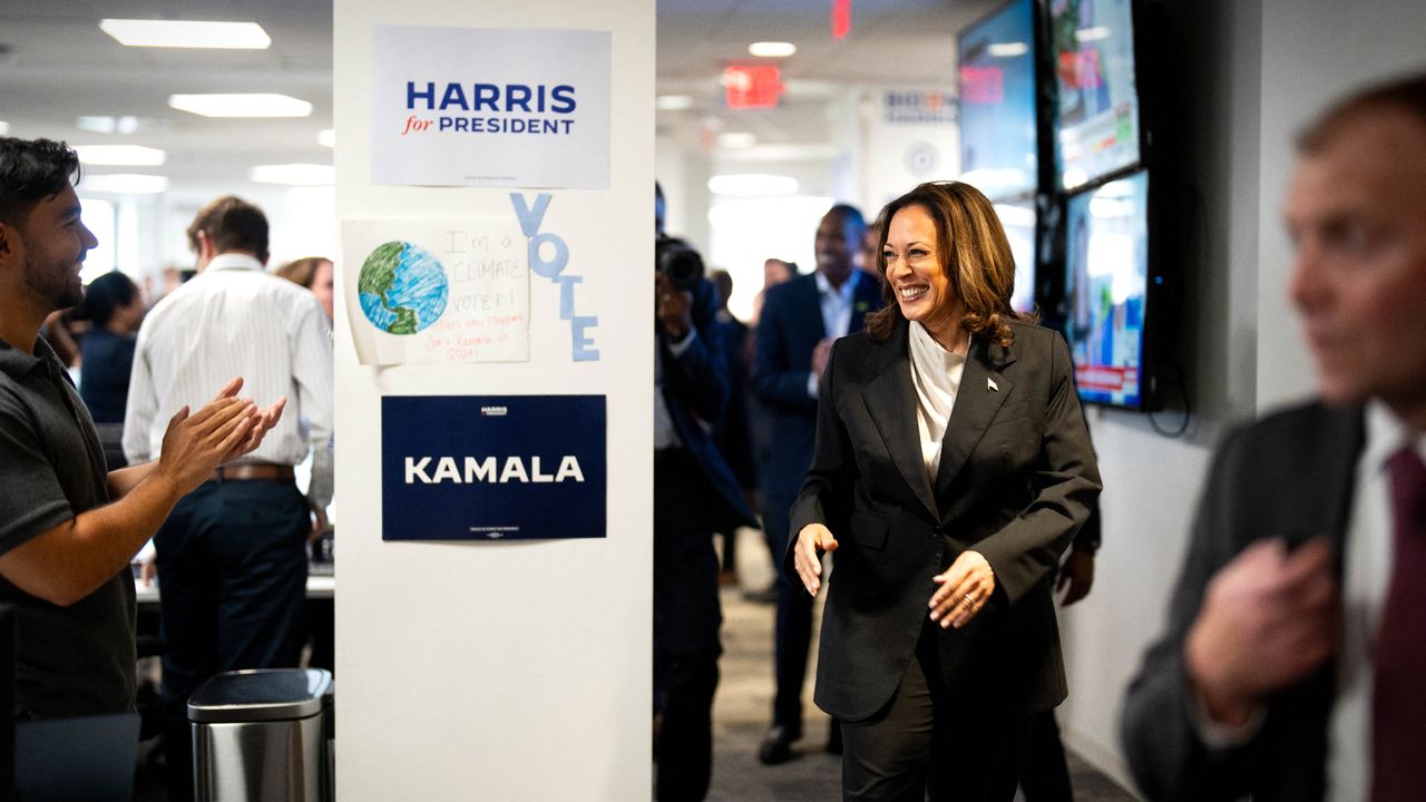 Vice President Kamala Harris greets workers at newly rebranded Harris campaign headquarters