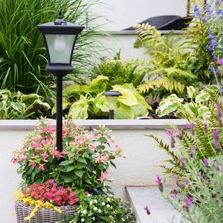 Solar powered lampost in potted plant