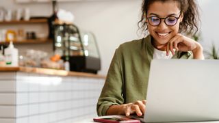 woman on laptop in cafe