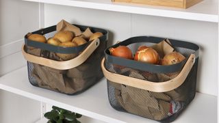 open weave storage baskets used to store vegetables in a pantry