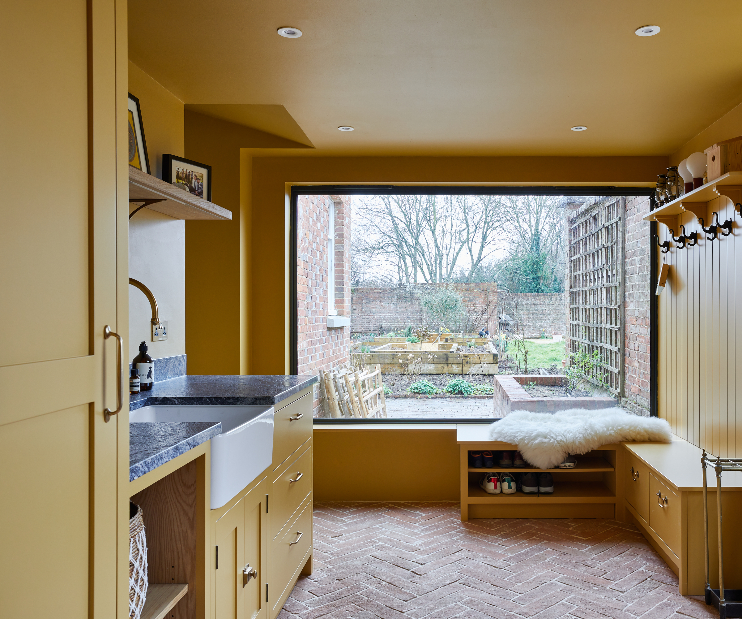 yellow utility room with large picture window at end