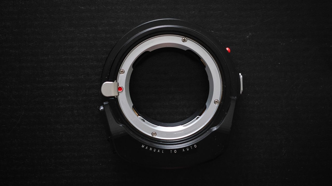 Megadap M2RF adapter on a black surface